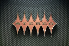 orange stereo emblem on mesh surface