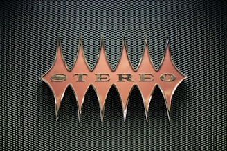 orange stereo emblem on mesh surface
