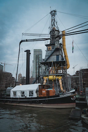 Historic black and white photo of the zeilvracht 1893 docked before restoration began.