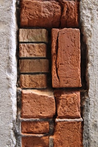 A close-up of bricks and cement bags.