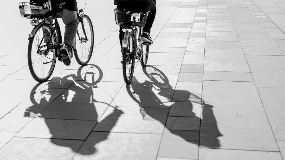 grayscape photo of person riding bike