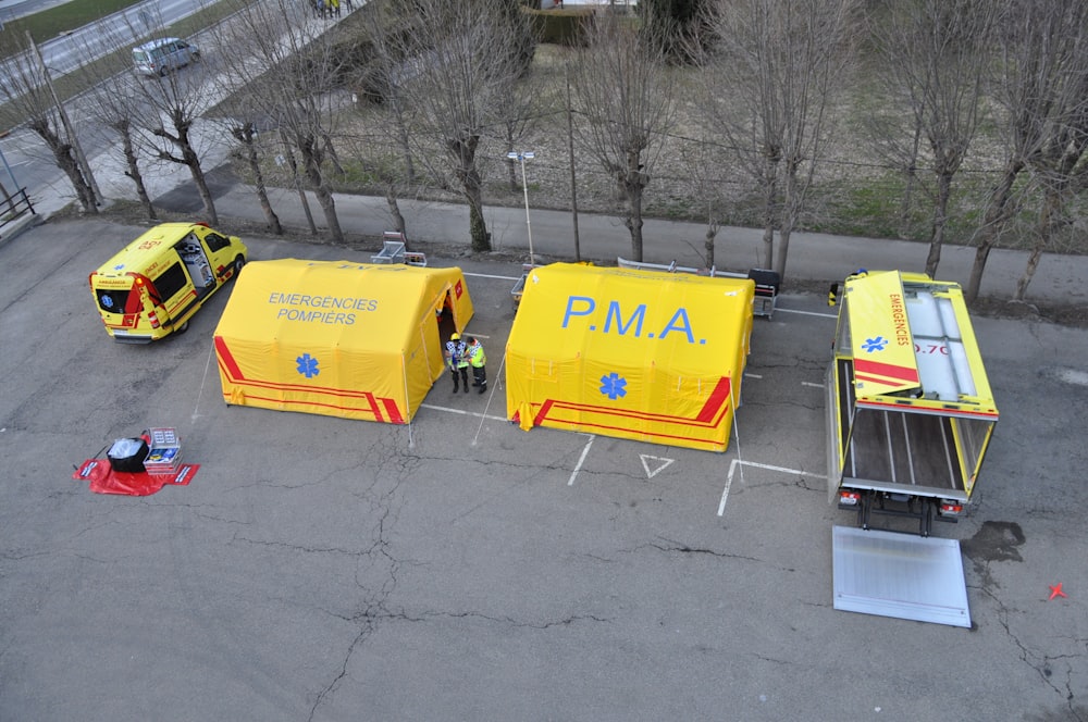 yellow van parked beside yellow tent