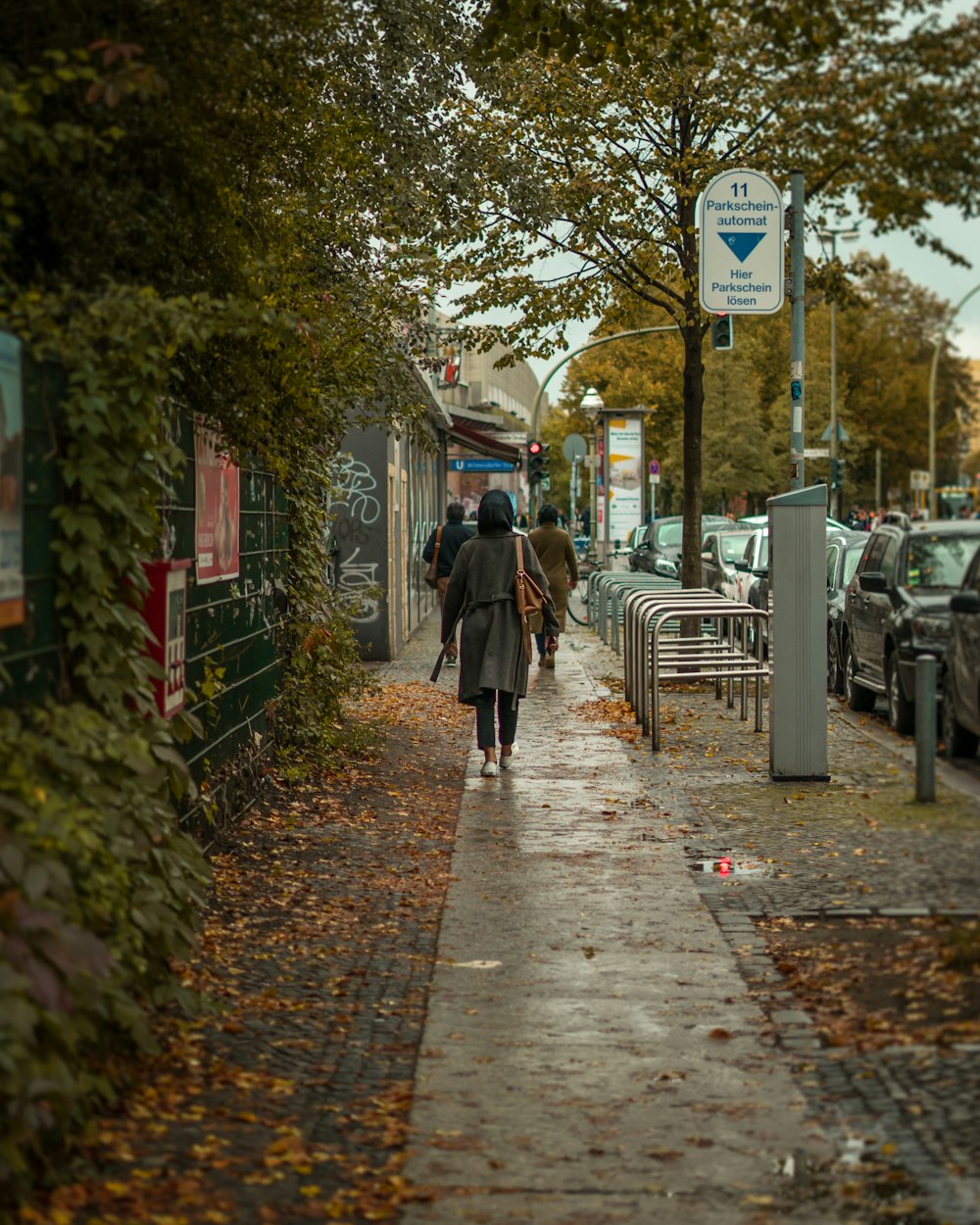 people walking on sidewalk during daytime