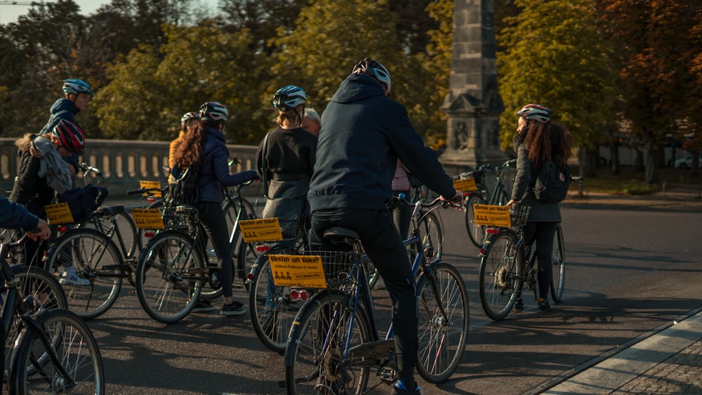 shallow focus photo of people riding bike