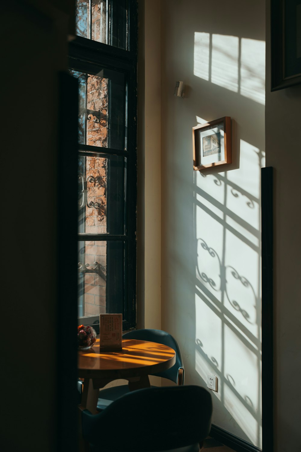 dining set beside window during day