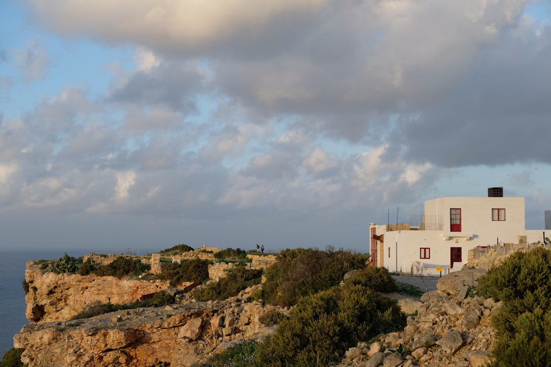 Coastal and oceanic landforms photo spot Tal-Mixta Cave Għajn Tuffieħa