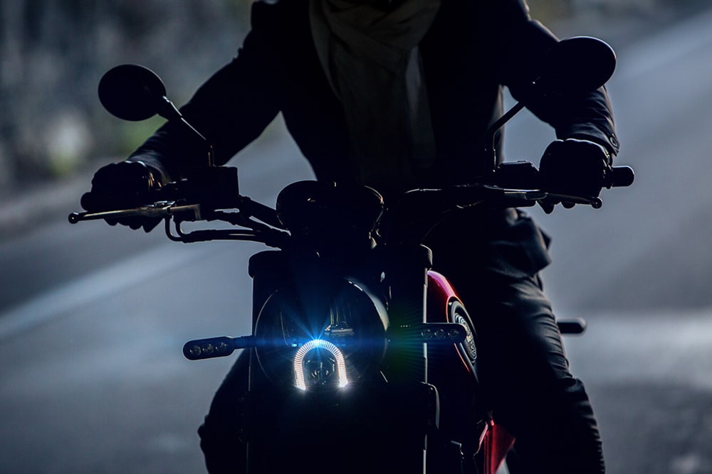 person riding motorcycle during night