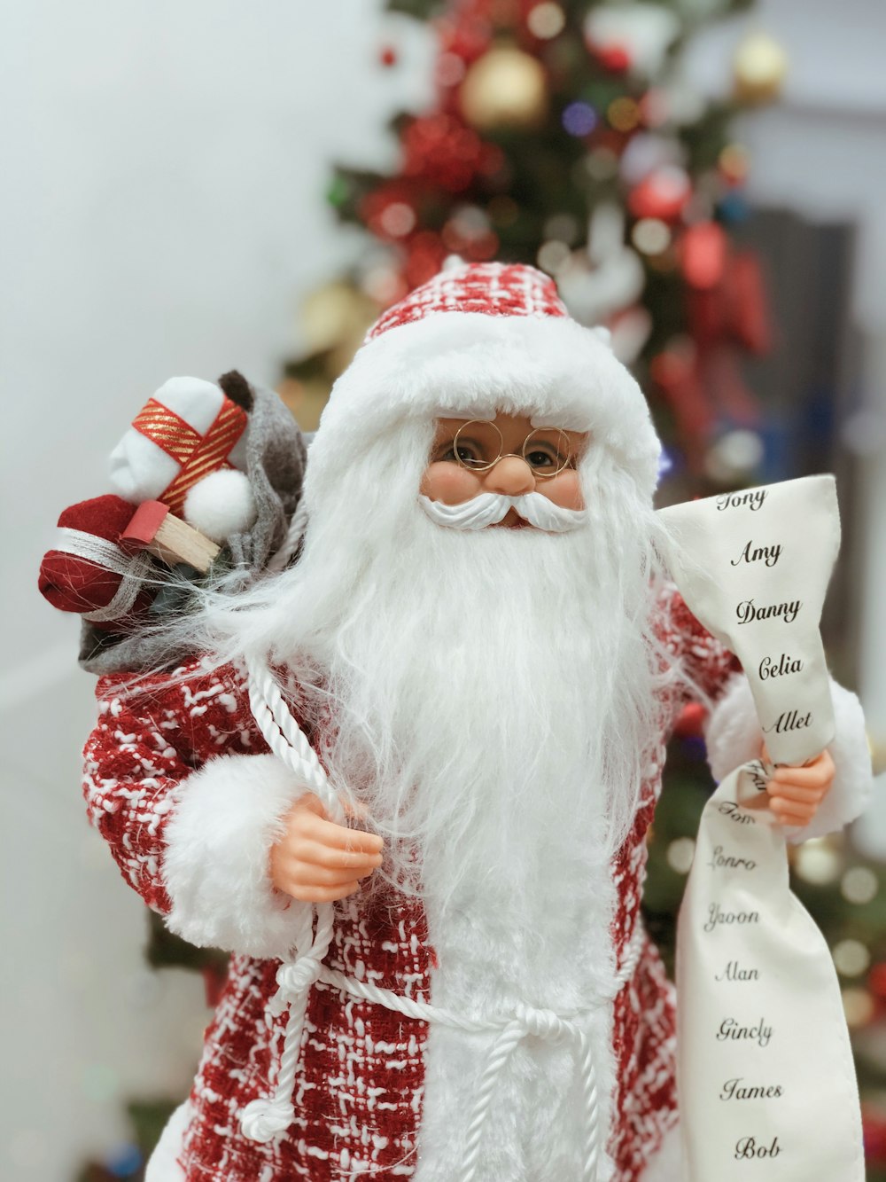 shallow focus photo of Santa Claus figurine