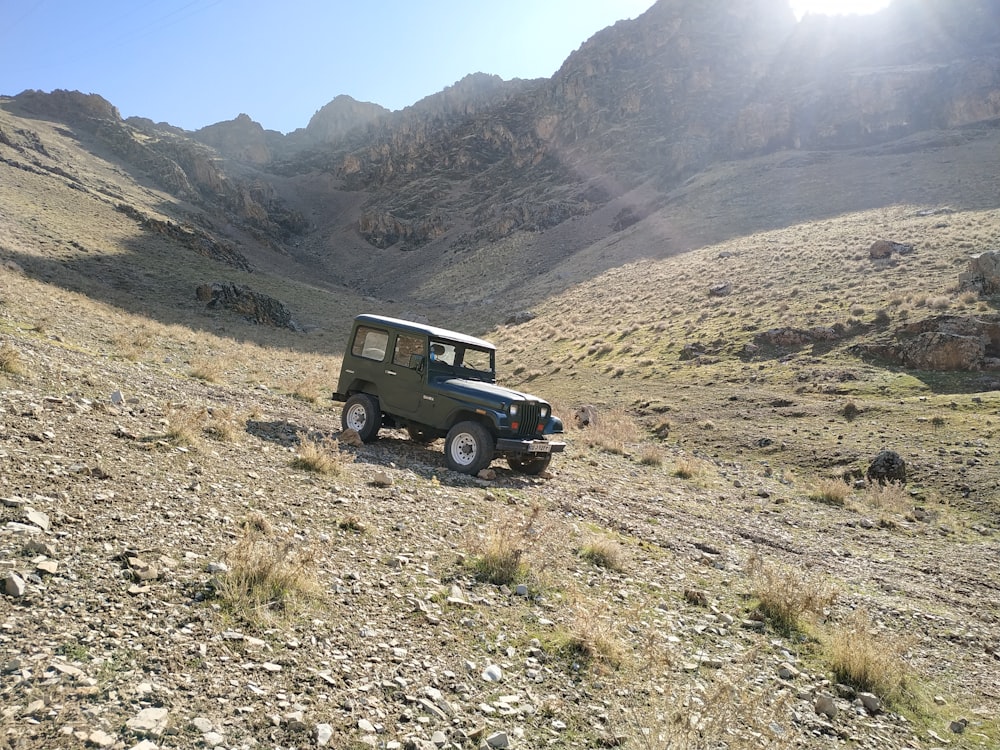 brown Jeep Wrangler on hill