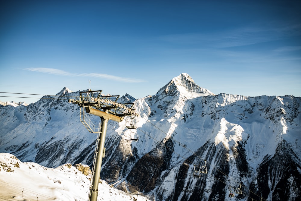 ski lift near glacier mountain during day