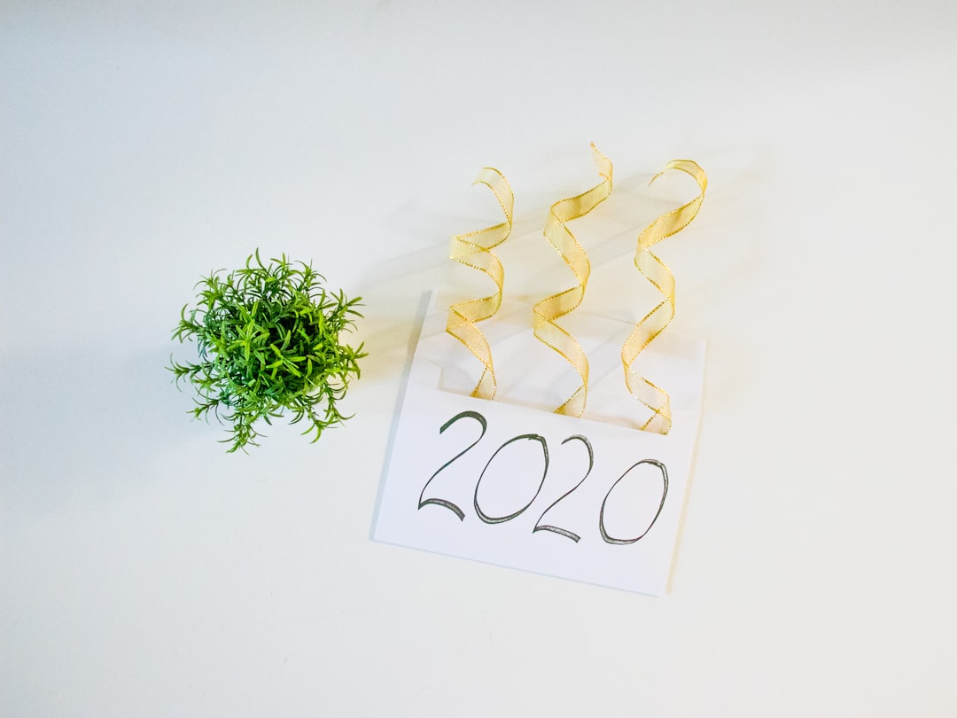 2020 letter beside green plant