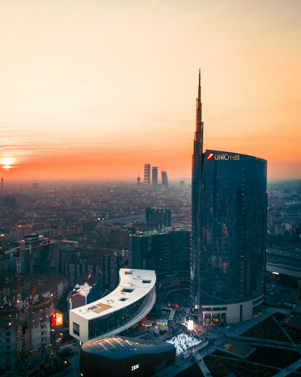 aerial photography of city with high-rise buildings under orange sky