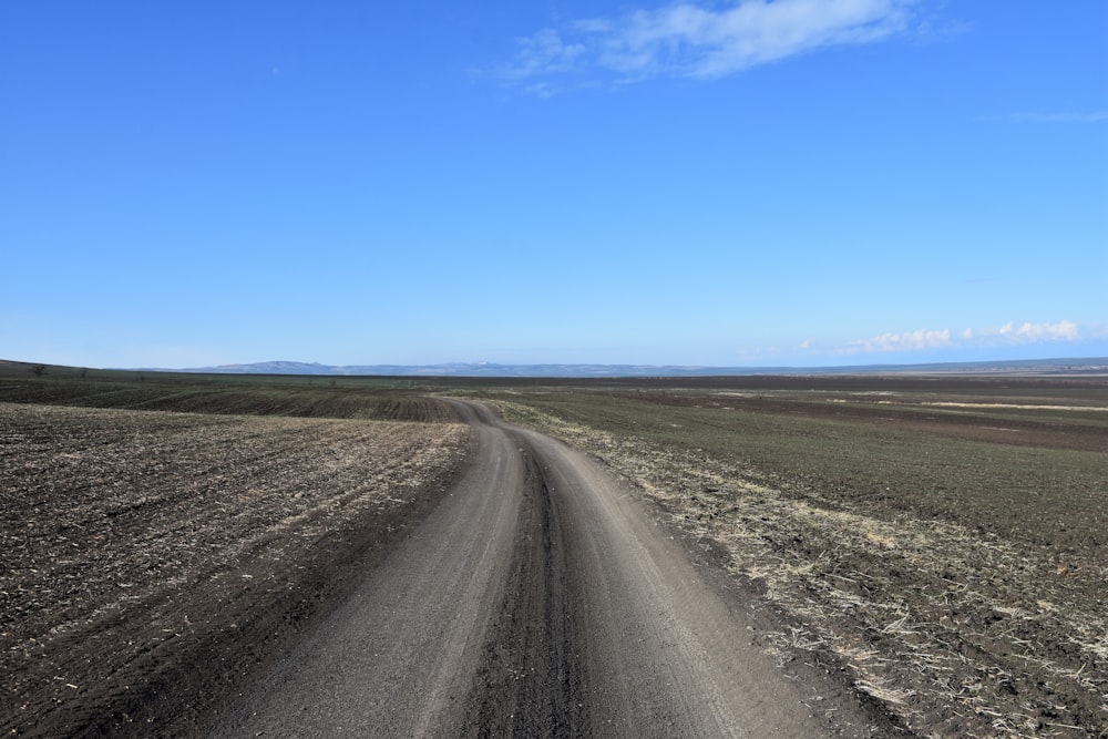 landscape photography of road under a calm blue sky during daytime