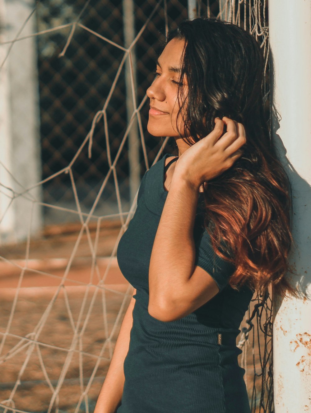 woman leaning against wall