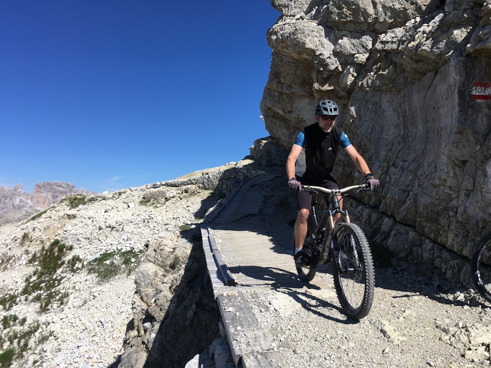 man riding bicycle photograph