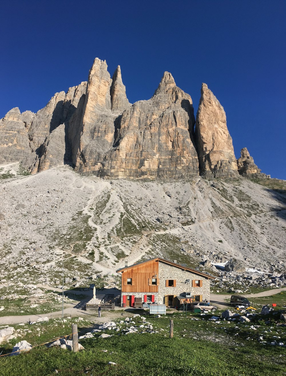 gray house beside cliff during daytime