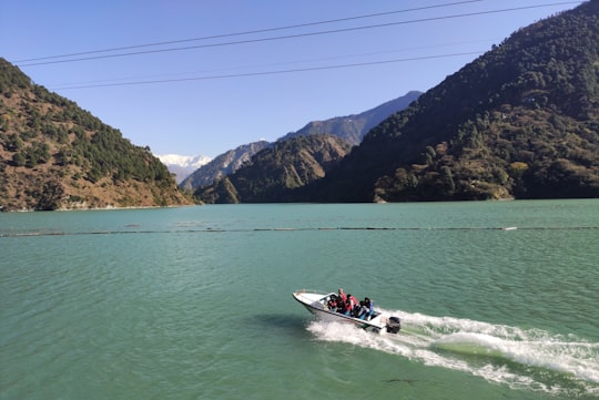 person riding on the speedboat photograph in Chamera Lake India