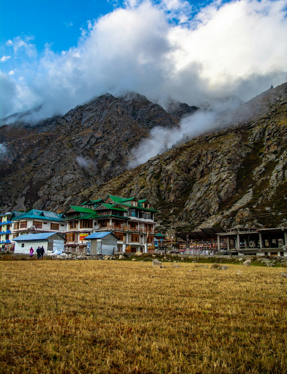 concrete buildings beside cliff during daytime