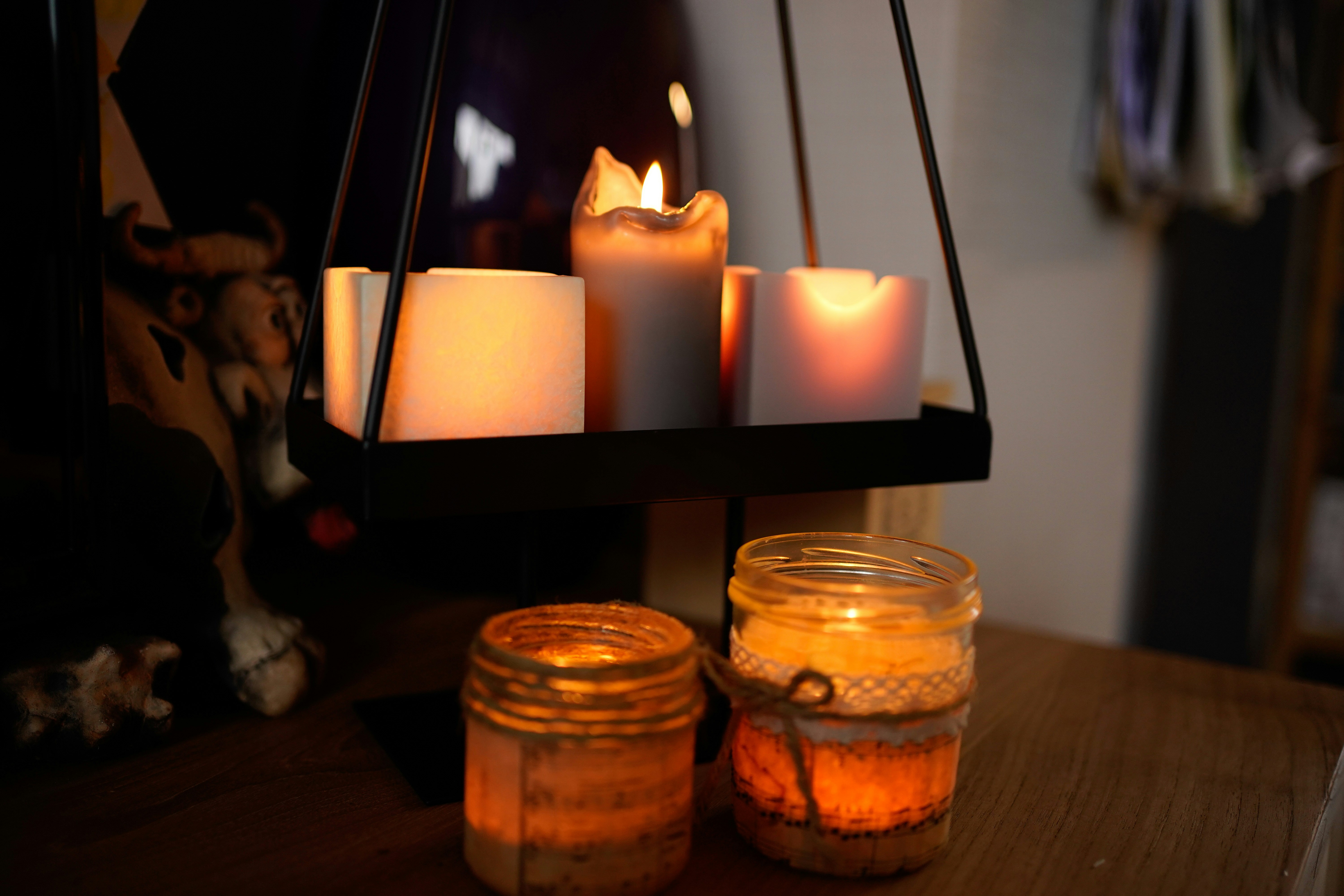 Soft warm candlelight in dark room, intimate atmospheric glow