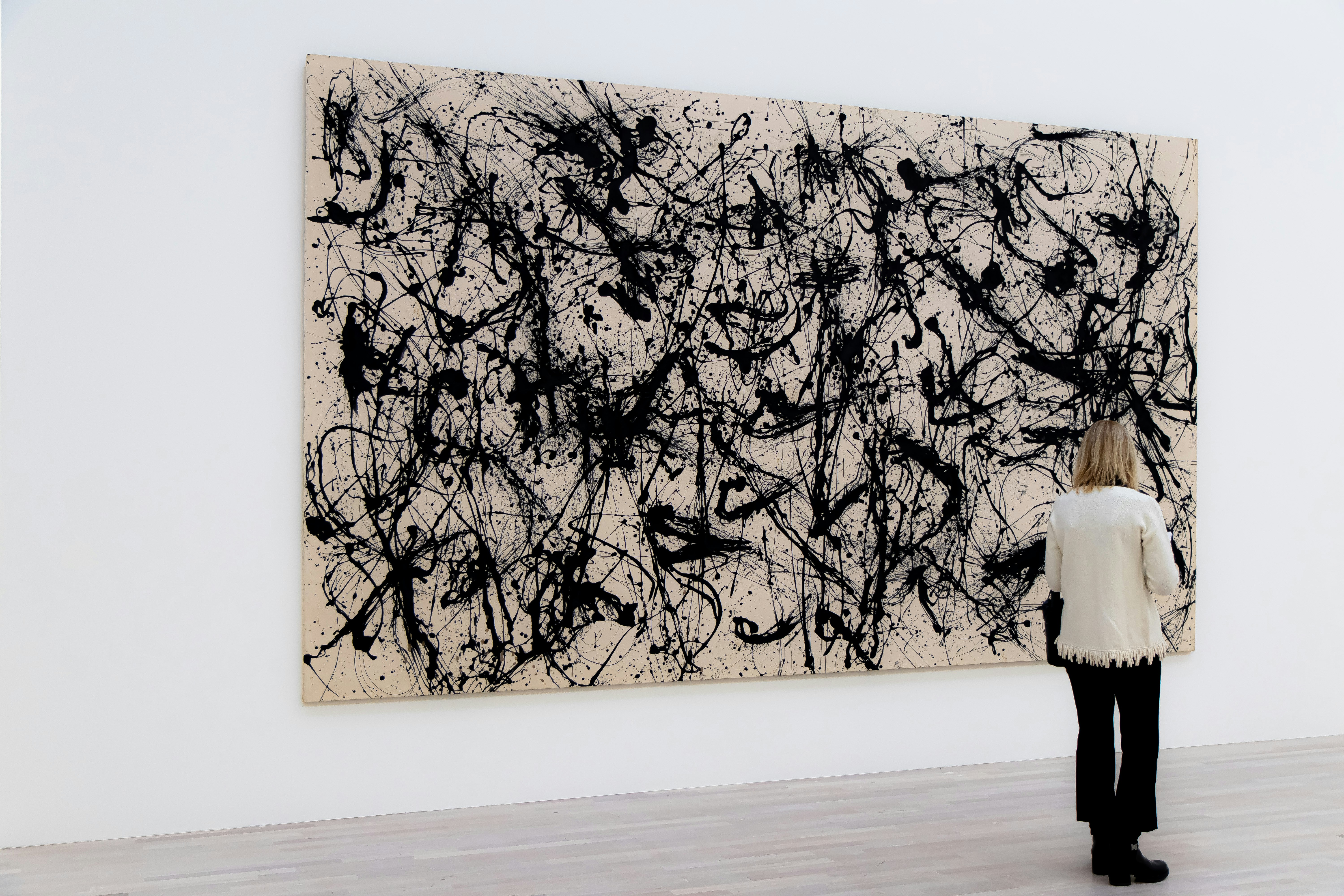 Woman beside painting