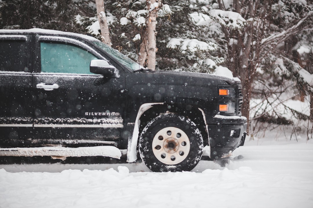 black Chevrolet Silverado on snowy field