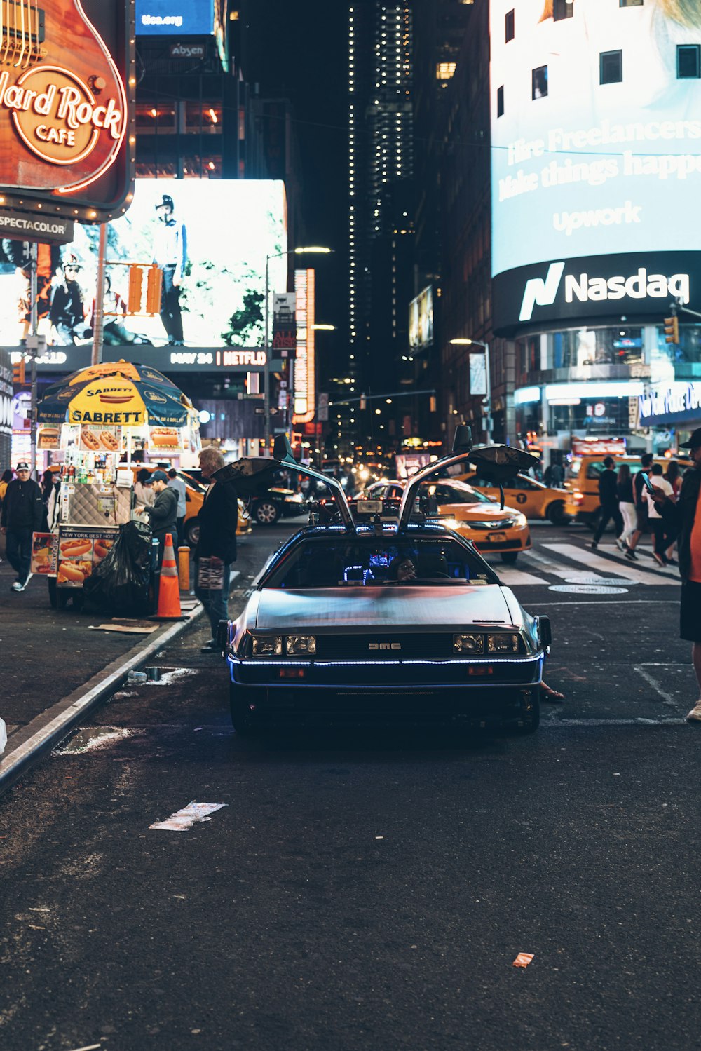 gray coupe on road at night