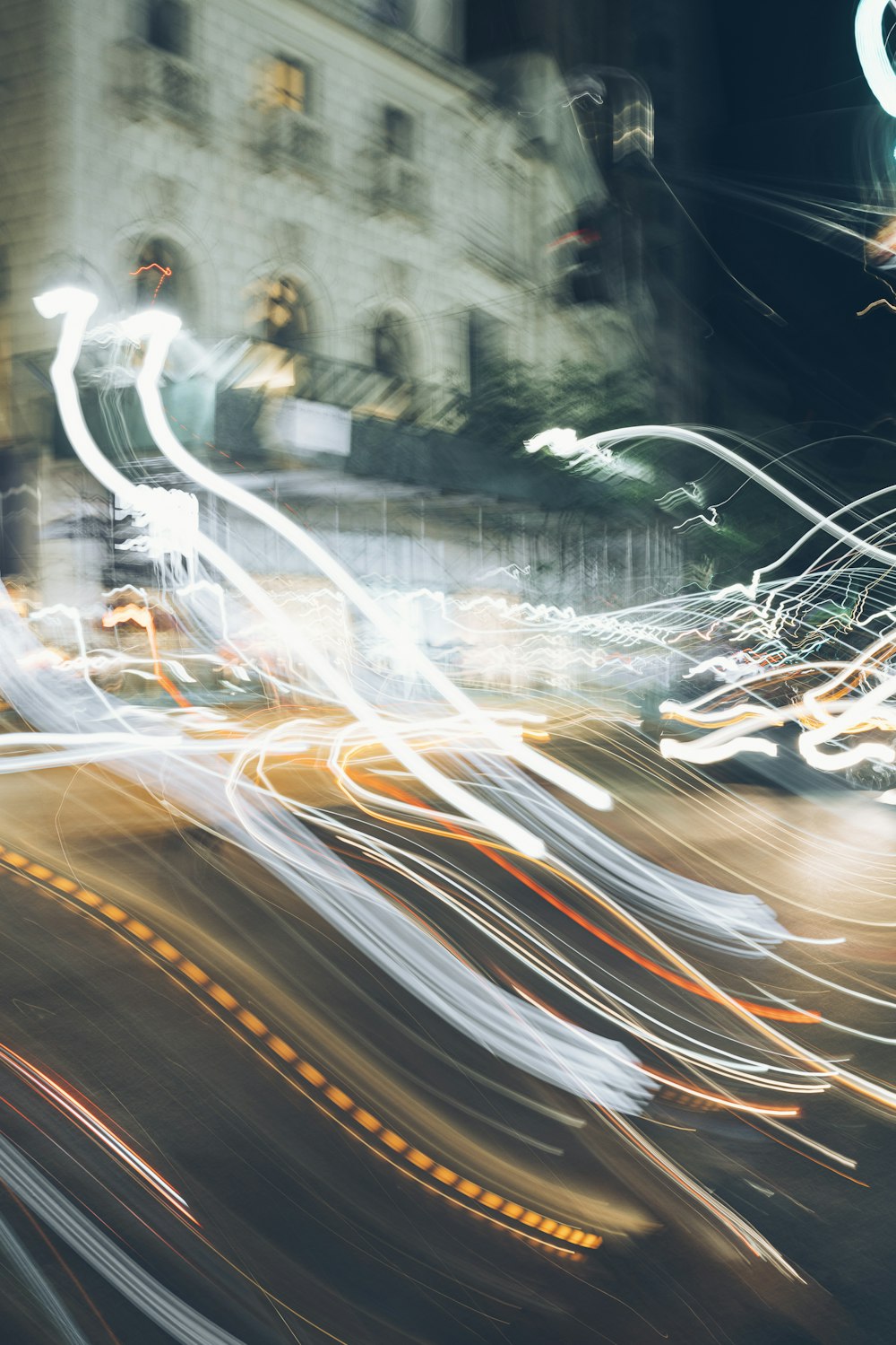 time-lapse photography of vehicle on road at night