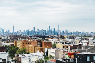rooftop view of new york neighborhood with city in background