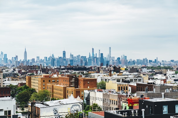 rooftop view of new york neighborhood with city in background