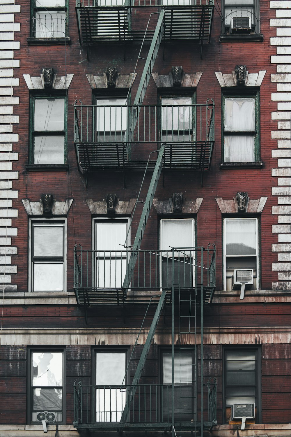 building with stairs fire exit during day