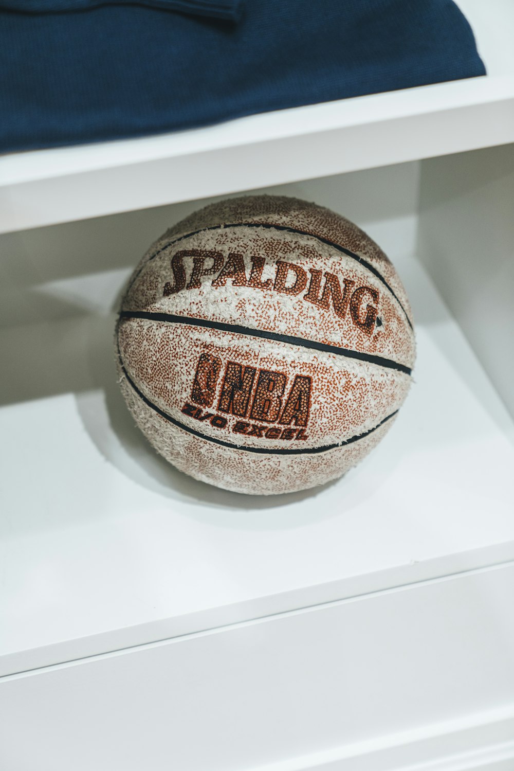 Spalding basketball in shelf