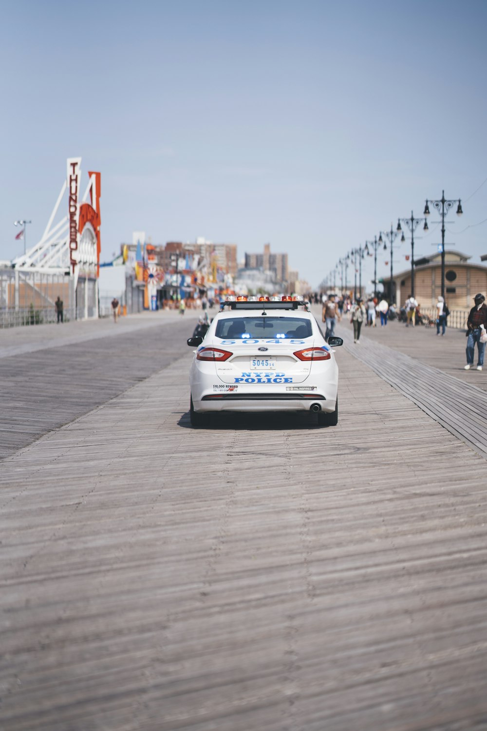 white vehicle running on the road