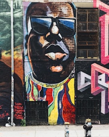 man wearing black sunglasses wall painting
