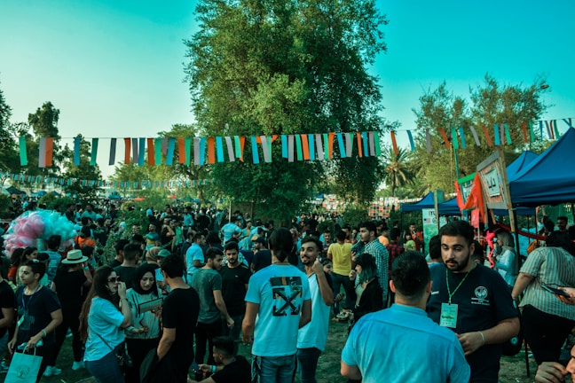A vibrant outdoor event with people enjoying the atmosphere.