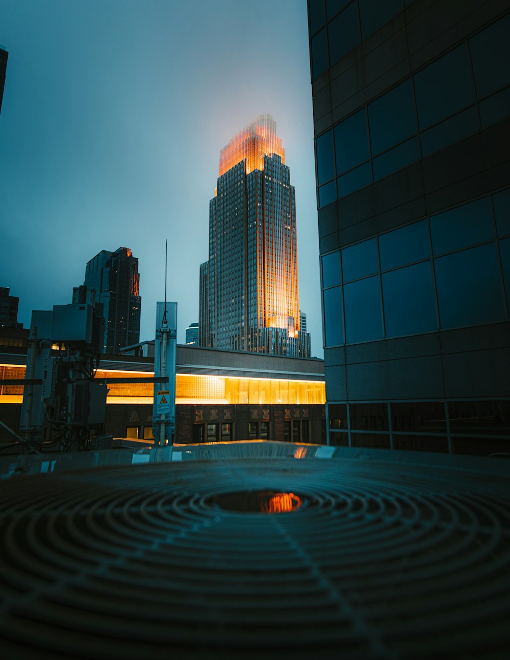 a very tall building sitting next to a very tall building