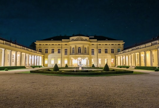 beige building during night in Károlyi Castle Hungary