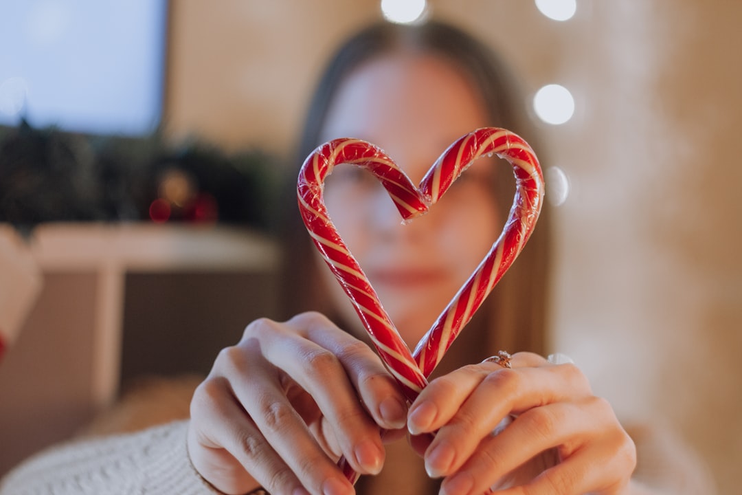 person holding candy cane