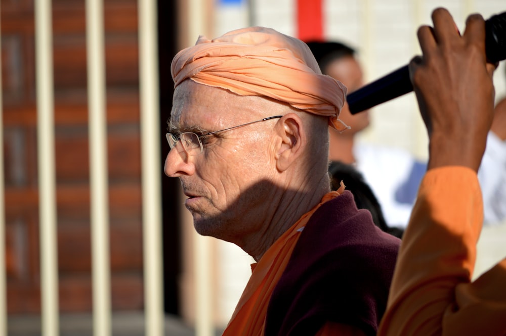 man wearing brown frame eyeglasses