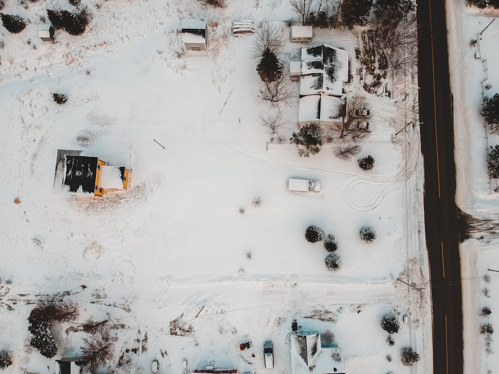 an aerial view of a snow covered parking lot