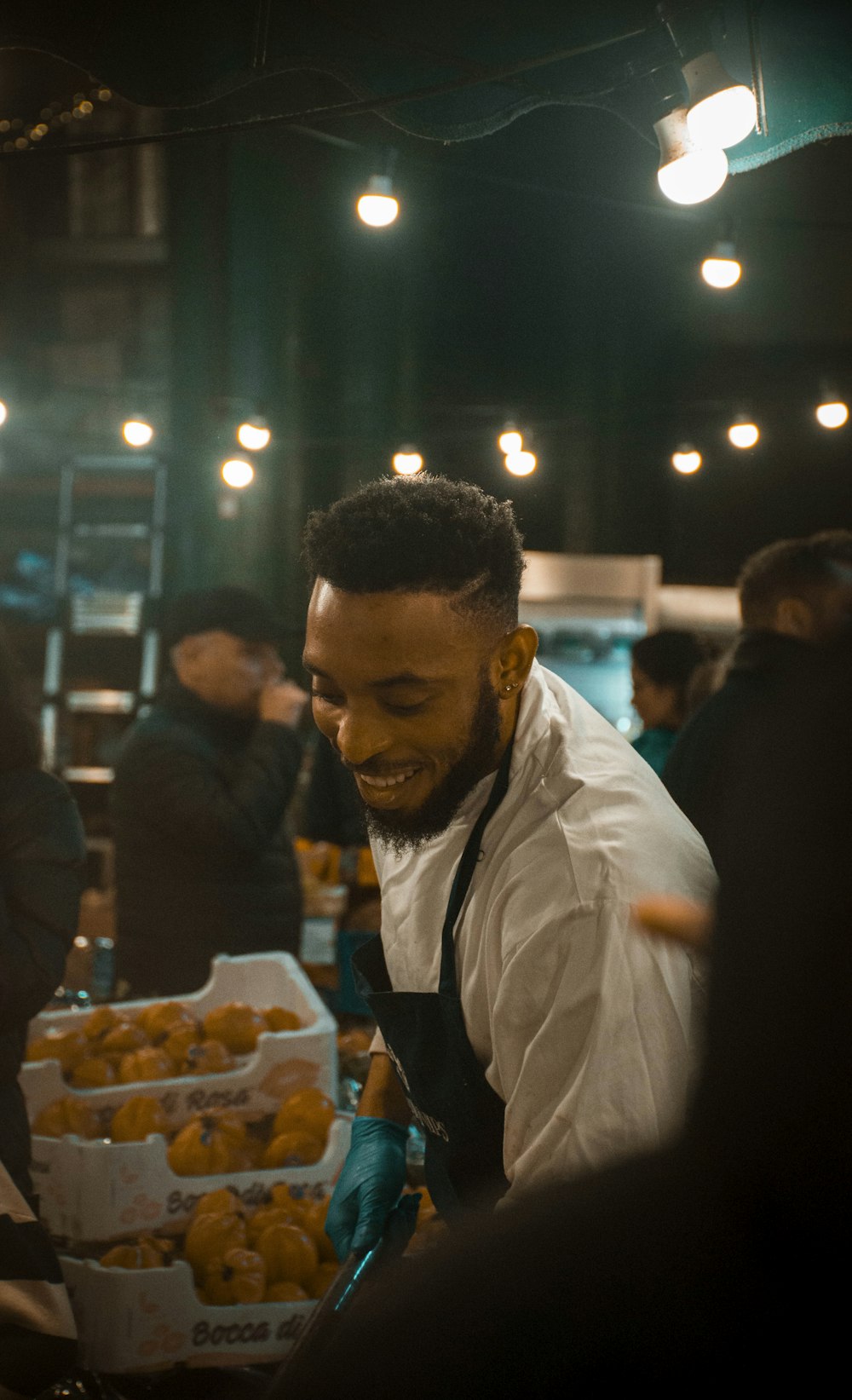 smiling man wearing apron