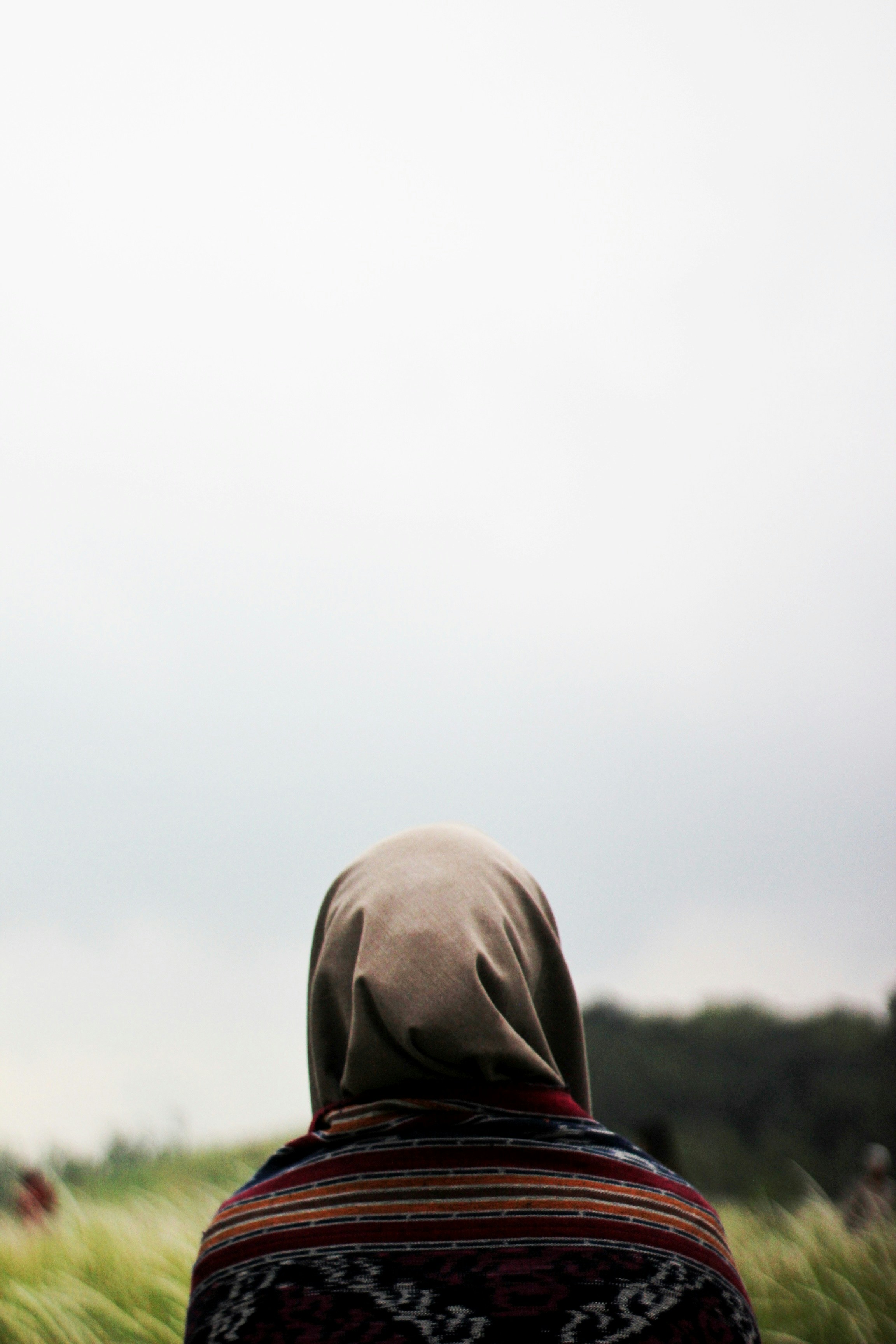 person wearing gray hoodie