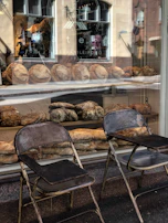 A cozy artisan bakery in a small town of Saône-et-Loire with fresh bread displayed.