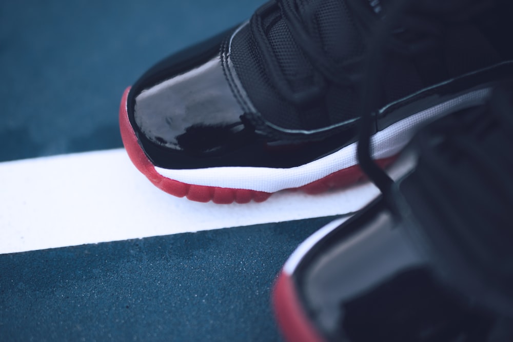 pair of black and red Air Jordan basketball shoes