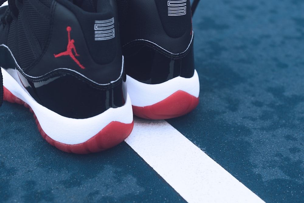 Pair or black-red-and-white Air Jordan athletic shoes photo – Free  Basketball Image on Unsplash