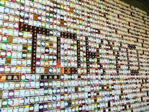 A colorful tile wall created by community members at a school fundraiser event.