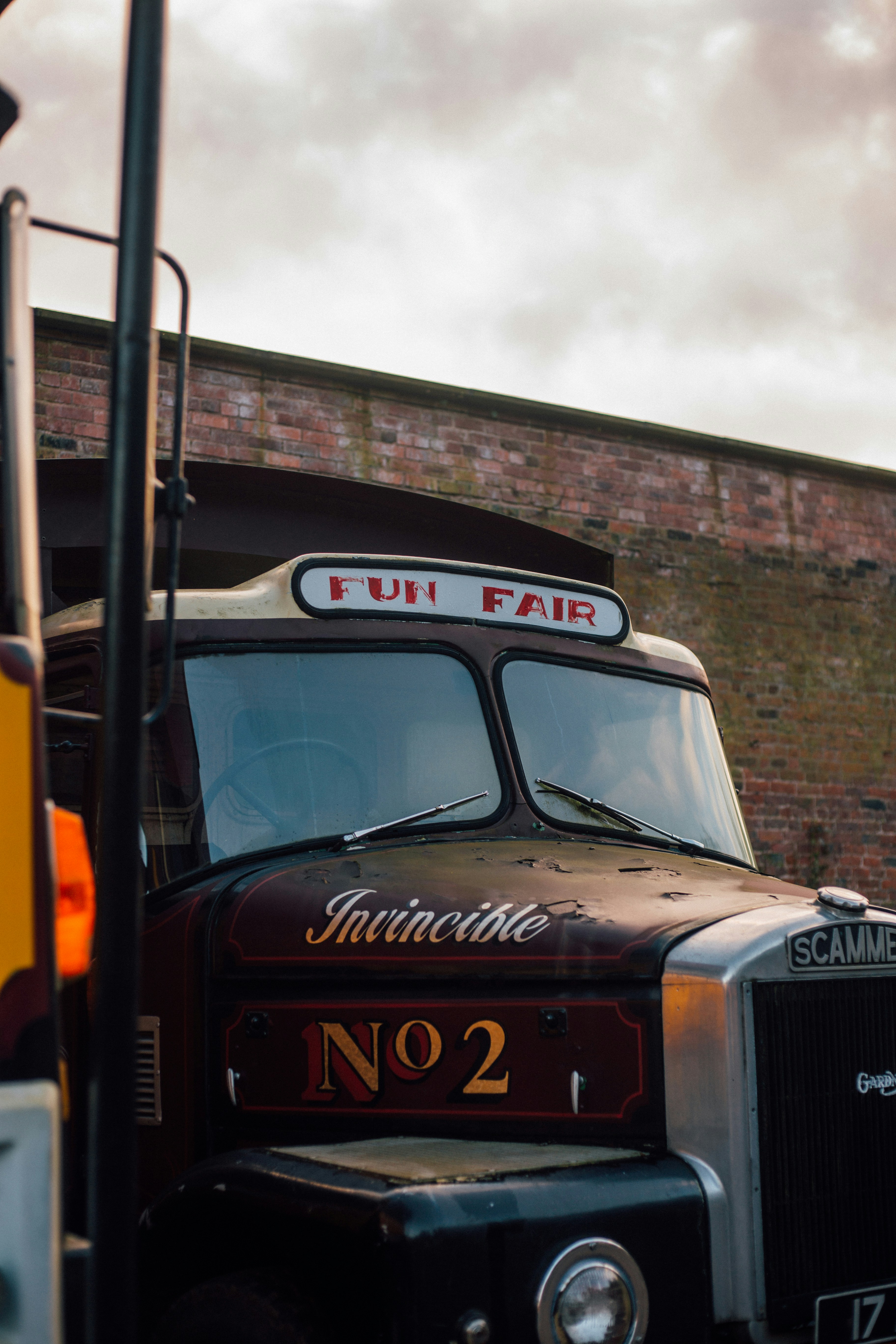 red bus parking near building