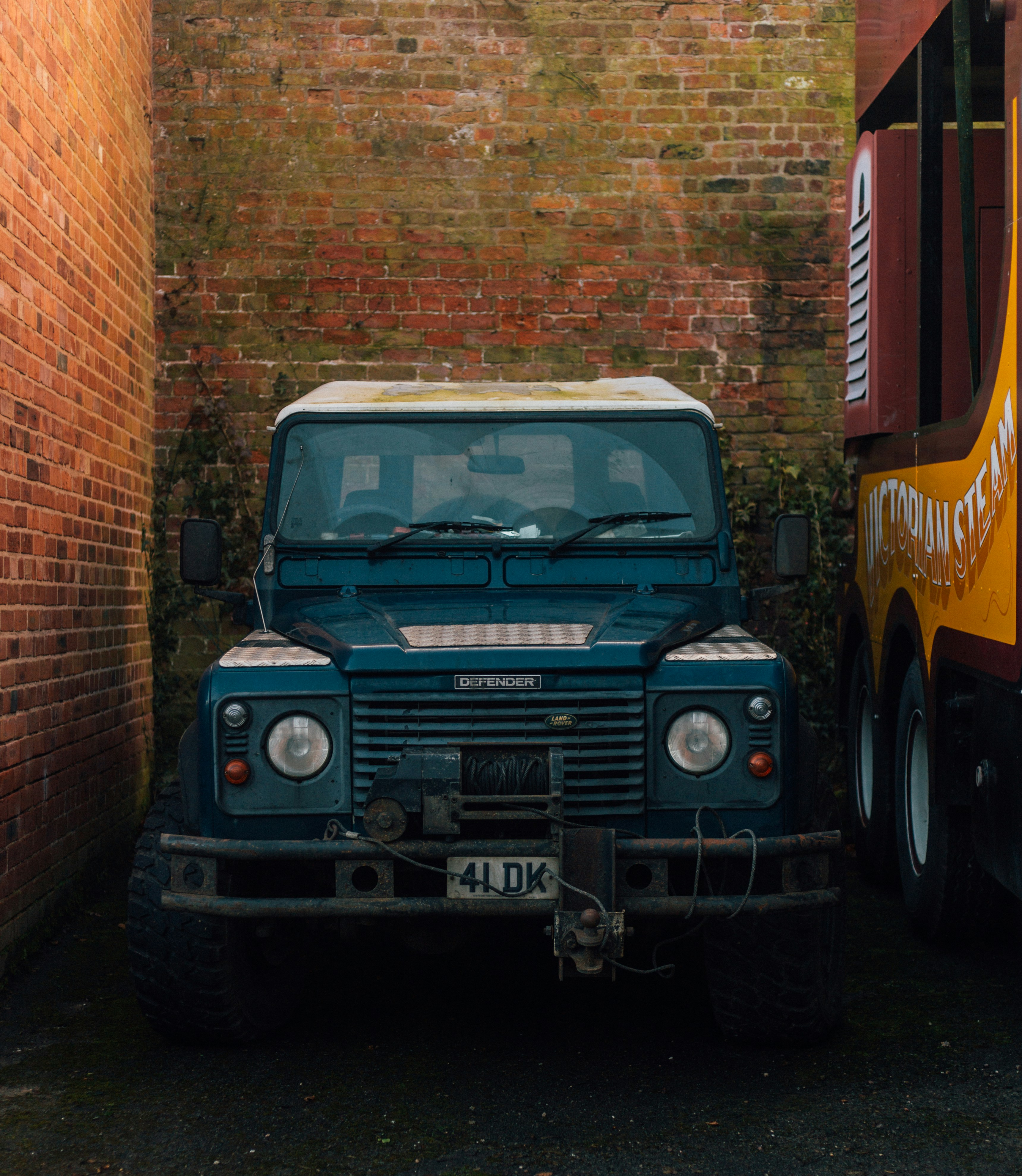 blue and white truck in a parking lot