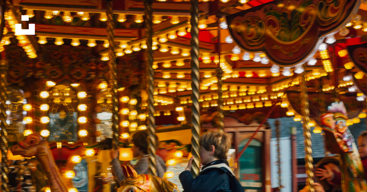 Children riding merry-go-round photo – Free Carousel Image on Unsplash