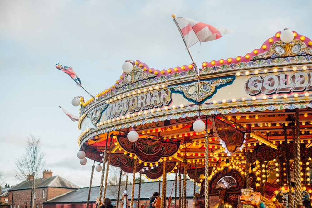 children riding merry-go-round during day