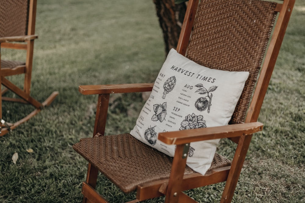 white pillow on wooden chair